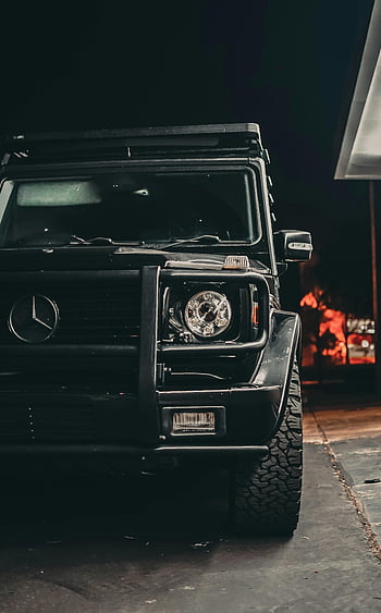 black Mercedes, luxury SUV, parked outdoors, night, close-up, black car, Mercedes-Benz, vehicle, night photography, outdoor scene, dark setting