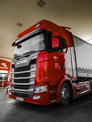 red truck, Scania truck, fuel station, modern design, clean lines, parked truck, bright red, truck parking, Scania vehicle, fuel stop, truck design