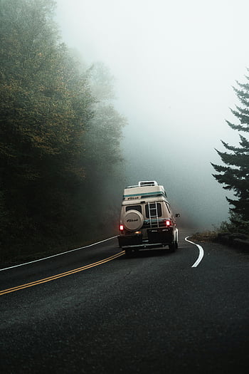 camper van, foggy rural road, serene scene, adventure, vehicle on the road, travel, countryside, misty weather, outdoor journey, road trip, nature exploration