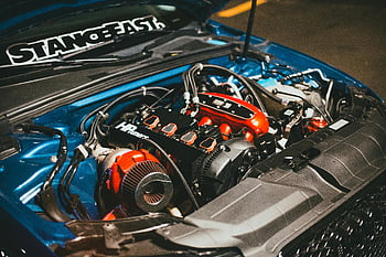 Audi engine bay, customized car engine, performance modifications, detailed engine view, car engine modifications, engine bay details, modified car engine, performance engine mods, engine customization, car engine performance, engine bay customization