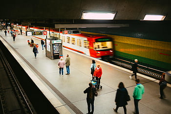 people walking, train station, vibrant subway, fast-moving train, platform scene, subway platform, commuters, urban transit, public transportation, underground station, train travel