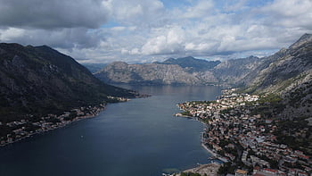 Kotor Bay, Montenegro, aerial photograph, coastal architecture, mountainous landscape, stunning view, bay scenery, coastal town, mountain backdrop, scenic bay, Montenegrin coast