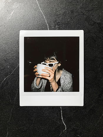 instant photo, woman with cup, stylish woman, sunglasses, drinking mug, Polaroid photo, dark background, casual style, black and white, mug shot, instant photography