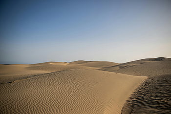 Maspalomas, sand dunes, Gran Canaria, Spain, blue sky, natural wonder, serene view, vast sand, desert landscape, outdoor scenery, travel destination