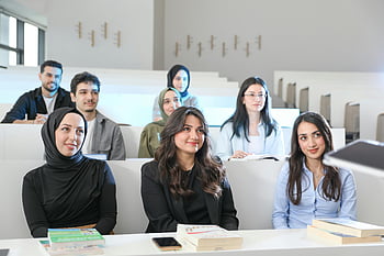 diverse university students, attending lecture, engaged students, attentive students, university classroom, group of students, diverse students, university lecture, classroom setting, educational environment, student engagement