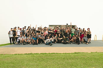 group photo, diverse friends, outdoor celebration, sunny day, joyful group, people taking photo, outdoor gathering, diverse group, friends celebrating, group celebration, sunny celebration