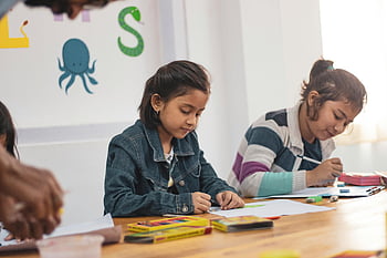girls, school work, creative drawing, Indian classroom, young students, educational activities, art supplies, learning environment, children studying, classroom setting, drawing tools