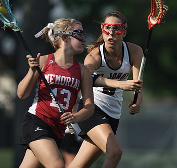 woman playing lacrosse, girl playing lacrosse, female lacrosse players, competitive game, outdoor lacrosse, action shot, Memorial team, lacrosse sticks, sports action, two players, lacrosse gear