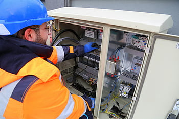 electrician, fuse box, safety gear, outdoor electrical panel, system functionality, engineer, electrical work, electrical maintenance, electrical panel repair, electrical panel installation, electrical panel inspection