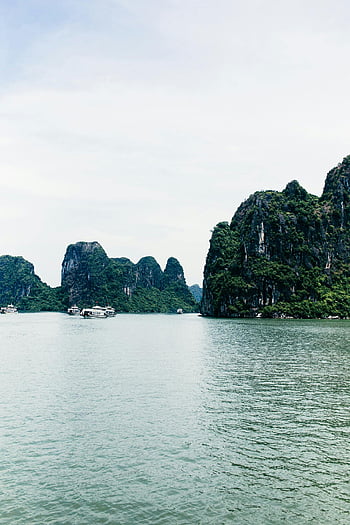 Green Islands, White Sky, limestone islands, Vietnam, Halong Bay, natural beauty, boats, water, landscape, travel, tourism