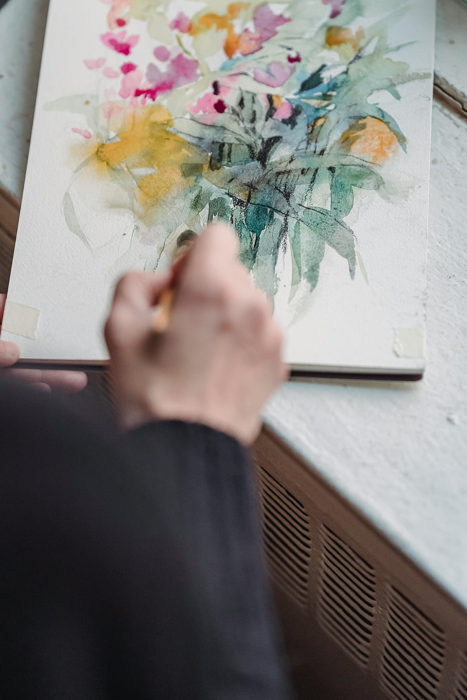 artist painting, floral watercolor, colorful artwork, canvas art, creativity, imagination, hand painting, watercolor painting, artistic process, floral artwork, painting technique