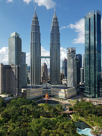 Petronas Twin Towers, Malaysia, Kuala Lumpur, modern skyline, lush greenery, skyscrapers, cityscape, urban landscape, iconic buildings, travel destination, architecture