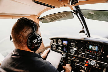 pilot, cockpit, headphones, airplane, flying, instruments, headset, aviation, pilot in cockpit, cockpit view, aircraft controls
