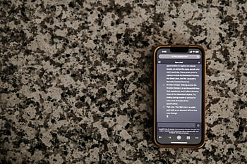 smartphone, chat app, granite countertop, message display, mobile device, text conversation, digital communication, phone screen, modern technology, indoor setting, electronic device