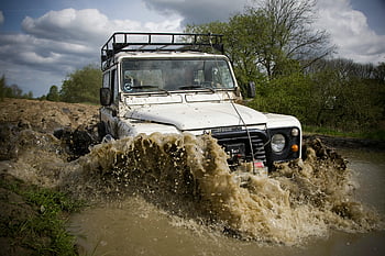 4x4 jeep, off-road trail, muddy trail, splashing water, rugged vehicle, action photo, off-road adventure, outdoor vehicle, muddy off-road, 4x4 action, off-road vehicle