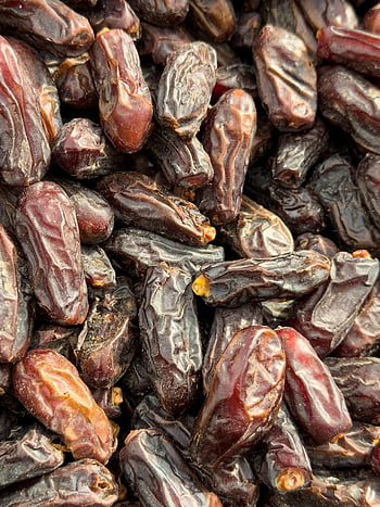 dates, close-up, Medjool dates, fresh dates, detailed texture, date fruit, close up dates, date texture, date freshness, date closeup, date detail