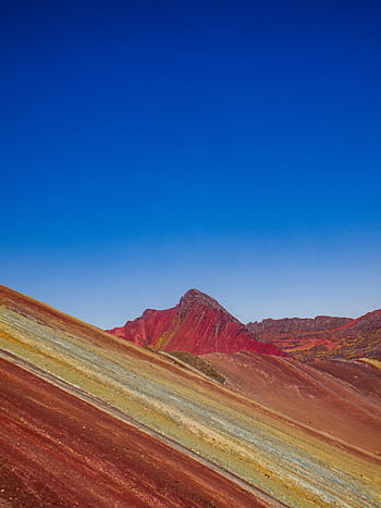 Rainbow Mountain, Cusco, Peru, vibrant colors, clear blue sky, mountain view, colorful landscape, natural wonder, travel destination, scenic beauty, outdoor adventure