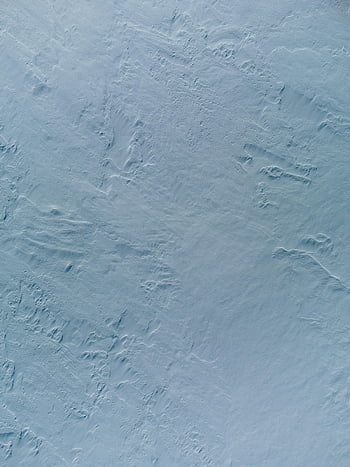 light blue surface, textured surface, subtle patterns, roughness, close-up, plain white, textured background, light blue texture, surface texture, subtle texture, rough surface