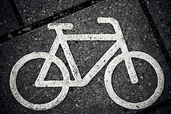 bicycle symbol, city pavement, urban cycling, black and white, close-up, road sign, bike lane, street marking, cycling infrastructure, pavement marking, urban transportation