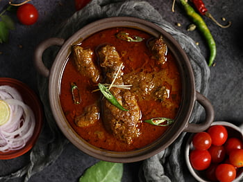 Indian curry, meat stew, clay pot, aromatic spices, chili garnish, traditional dish, curry meat, spicy stew, Indian cuisine, clay serving, garnished chili
