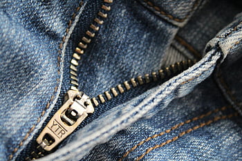 blue denim pants, blue jean zipper, YTR branding, denim texture, close-up jeans, detailed jeans, denim fabric, zipper detail, blue jeans, denim zipper, jeans texture