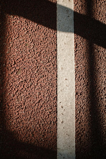 Brown and White Concrete Wall, textured asphalt, painted stripe, shadow play, urban setting, close-up, concrete wall, asphalt texture, painted line, urban texture, shadow contrast