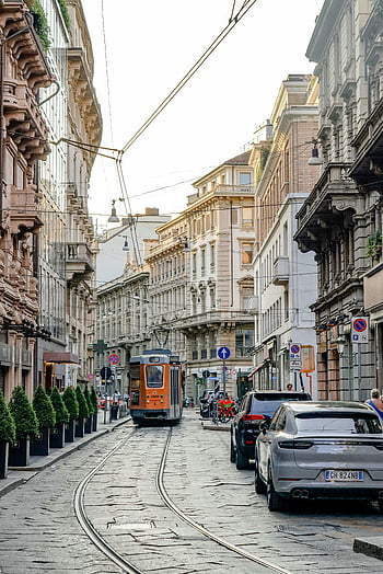 Via Torino, Milan, Italy, tram, historic buildings, classic scene, street view, urban landscape, European city, cobblestone street, public transportation