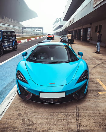 Blue McLaren, supercar, race track, Greater Noida, India, vibrant blue, parked, vehicles, people, launch control, sports car