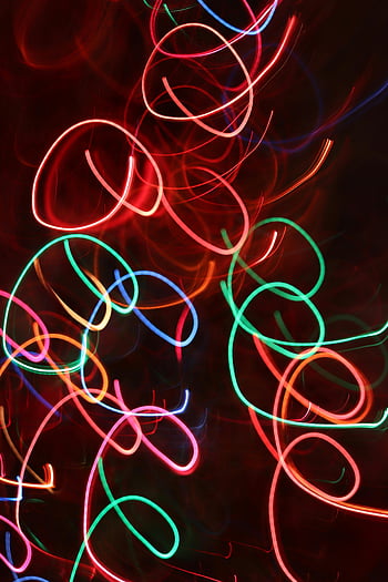 colorful neon lights, dark background, long exposure, abstract patterns, neon light trails, dynamic shot, colorful abstract, neon trails, dark backdrop, light patterns, vibrant neon