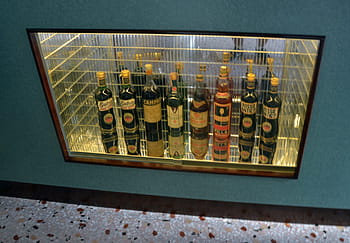 spirits, array, Milan, contemporary art museum, bottles, display, glass case, alcohol, vintage, exhibition, art