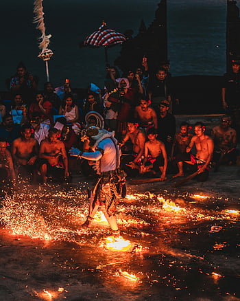 fire dance, cultural event, nighttime performance, spectators, traditional dance, cultural celebration, fire performer, cultural festival, nighttime event, cultural tradition, fire show