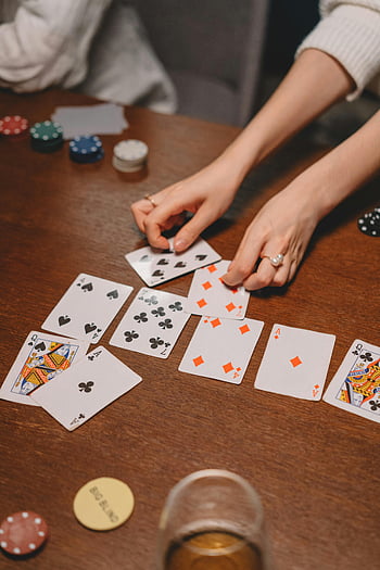 poker-game-wooden-table-playing-cards-close-up-shot-poker-chips-card-game-hands-playing-poker-table-game-in-progress-poker-night-thumbnail.jpg