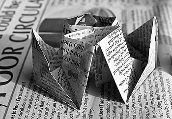 newspaper origami, origami rose, black and white origami, newspaper text, artistic creativity, paper folding, origami art, newspaper craft, creative origami, origami design, black and white photo