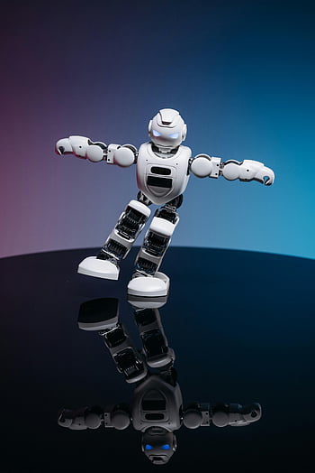 white toy robot, blue pink background, close up shot, dynamic pose, glossy reflective surface, gradient background, futuristic design, robot toy, playful scene, modern toy, technology themed