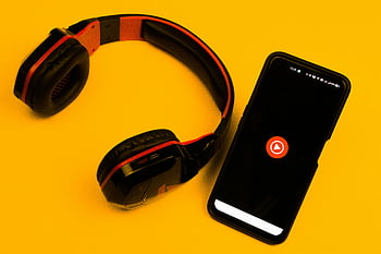 youtube-music-stream-songs-music-videos-wireless-headphones-smartphone-play-icon-vibrant-yellow-background-music-app-mobile-device-audio-streaming-thumbnail.jpg