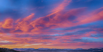 mountains during sunset, stunning sunset, pink hues, orange hues, mountainous horizon, sunset over mountains, colorful sunset, mountain sunset, sunset landscape, nature photography, scenic sunset