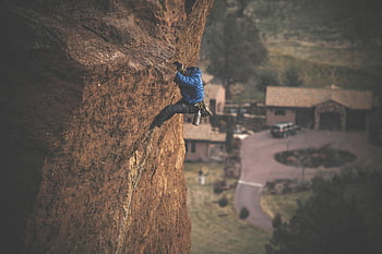 rock climbing, man climbing, blue jacket, steep rock face, adventure, strength, outdoor activity, cliff climbing, daring climber, rock face, adventure sport