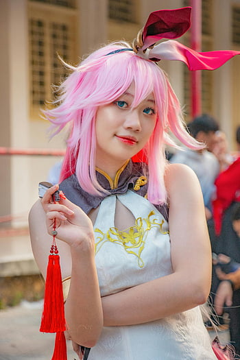 cosplay, pink hair, player character, costume, vibrant details, energetic portrait, woman, close-up shot, tassel, red tassel, cosplay event
