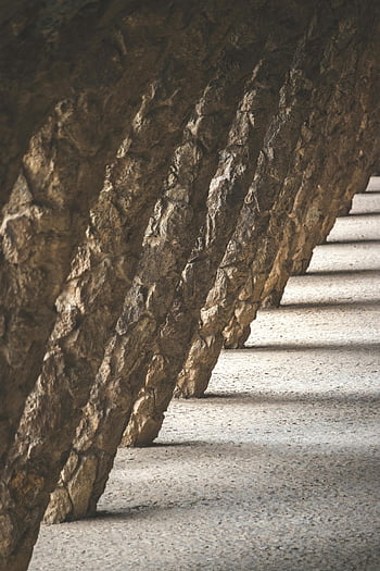 돌의 아치 길, 반복적 인 패턴, 건축 환경, 석 기둥, 건축 설계, 석조 구조물, 패턴화된 건축, 돌 기둥, 건축 세부, 돌의 반원형, 건축 요소