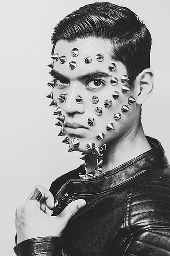 black and white, crew neck shirt, young male model, spikes, leather jacket, black and white portrait, facial spikes, punk style, edgy fashion, alternative fashion, monochrome photography