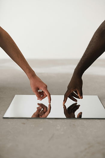 hands touching mirror, different ethnicities, minimalist mirror, reflection, diversity, unity, minimalist design, cultural connection, human interaction, simplicity, reflection art