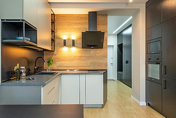 modern kitchen design, built-in appliances, sleek cabinets, wood accents, spacious kitchen, contemporary kitchen, stainless steel appliances, kitchen island, open shelving, modern lighting, hardwood floors