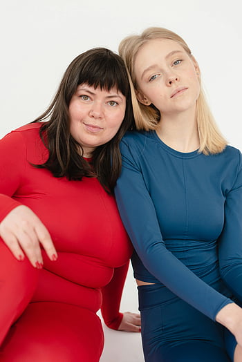 women in sportswear, different body types, colorful activewear, body positivity, diversity, confident poses, two women, sportswear, activewear, body types
