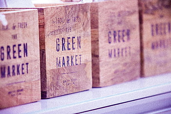 brown wooden crate, vintage wooden boxes, green market text, commerce themes, close-up photo, wooden crates, market boxes, green market, vintage crates, commerce props, wooden box
