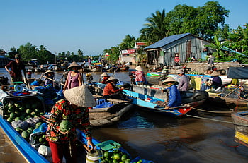 floating market, Ho Chi Minh City, Vietnam, local culture, commerce, river scene, vibrant scene, traditional boats, watermelons, people, trading