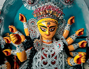 Colorful Durga Goddess statue, Durga idol, Durga Puja festival, Kolkata, India, adorned ornaments, Hindu deity, religious art, traditional attire, cultural celebration, festival decoration