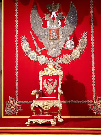 luxurious throne, ornate throne, red backdrop, historical emblems, royal chair, golden throne, imperial throne, decorative throne, throne room, royal emblem, red and gold throne