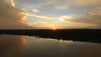 panoramic photography, island, golden hour, sunset, tranquil river, vibrant sky, sunset view, river reflection, scenic landscape, nature photography, peaceful scenery