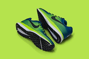 sports shoes, blue and green sneakers, athletic fashion, vibrant green background, modern sneakers, colorful sports shoes, athletic footwear, fashion sneakers, sports footwear, green sneakers, blue sneakers