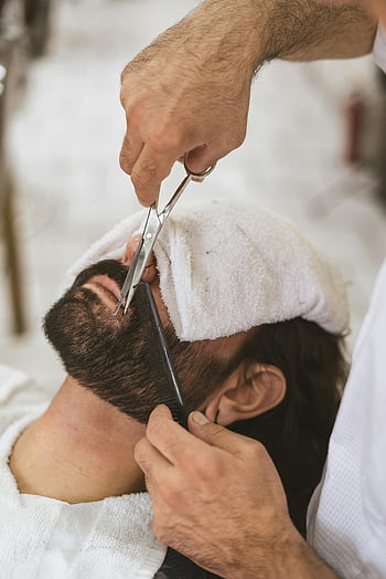 barber, grooming, facial hair, beard trimming, scissors, comb, close-up, client, barber shop, men's grooming, beard care